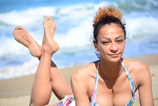Photo shoot on the beach of a middle-aged woman in a sunny day