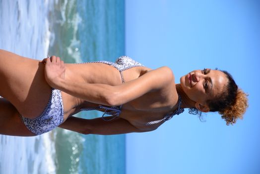 Photo shoot on the beach of a middle-aged woman in a sunny day