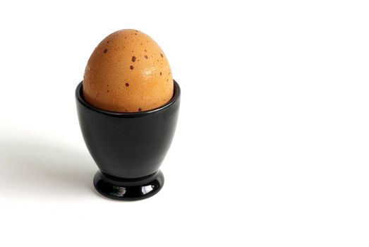 Soft-boiled egg in the black cup