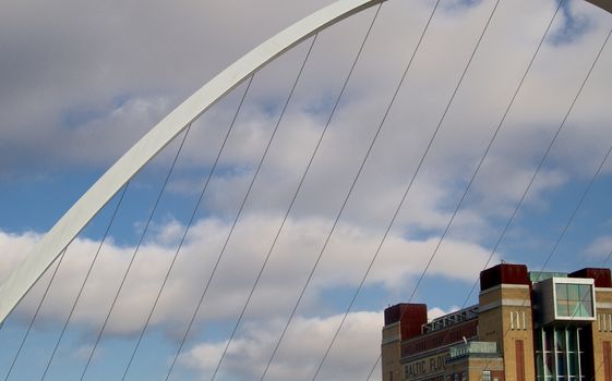 Millennium Bridge and top of the Baltic Art Museum in Newcastle, North of England