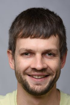 The closeup portrait of a happy man