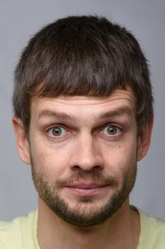 Close-up portrait of a man with bulging eyes of European appearance