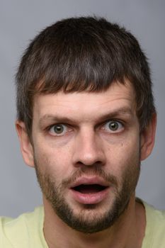 Closeup portrait of astonished man of European appearance