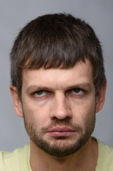 Close-up portrait of a gloomy tired man of European appearance