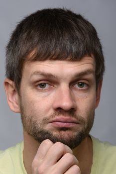 Closeup portrait of a skeptical man of European appearance