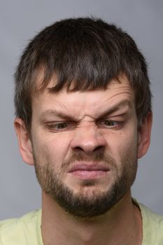 Closeup portrait of a man looking at his nose, European appearance