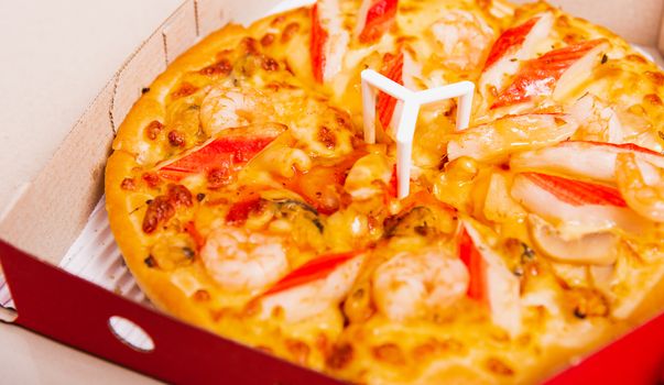 Hot Homemade, Vegetarian fast Italian food, Delivery Pizza pepperoni, cheese many slices in an open cardboard box