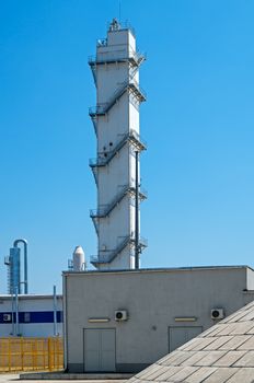 Manufacturing belfry electric steel plant on blue sky background.
