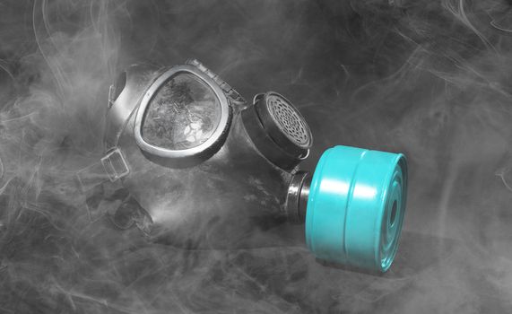 Vintage gasmask isolated on black background - Smoke in the room - Blue filter