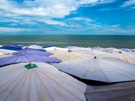 Large umbrella crowded along the beach