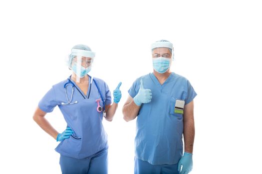 Two rapid response critical care nurses give a thumbs up hand gesture.  They are wearing scrubs and PPE