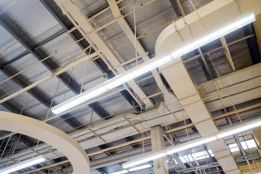 Ceiling mounted Lamps pipes and air ducts and communication system in the hall