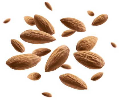 Almond nuts levitate on a white background.