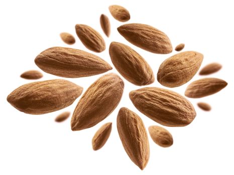 Almond nuts levitate on a white background.