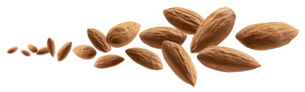 Almond nuts levitate on a white background.