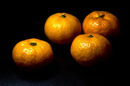 Close-up on glossy surface of freshness orange fruits