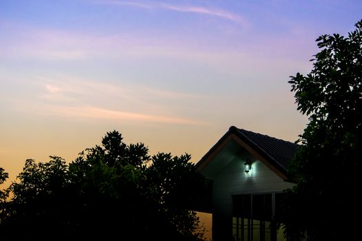 Silhouette of house and small lighting in morning