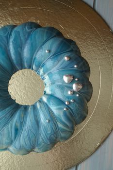 Cake of the marine, sea theme, decorated with blue mirror glaze and silver decoration