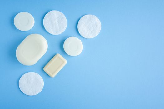 Composition of soap and cotton pads top view. Self hygiene against bacteria and viruses. Compliance with hygiene and sterility to combat coronavirus.