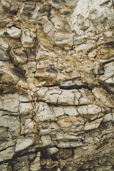 Rough clay rock and dirt under ground texture, Earth brown dry mud pattern background vertical