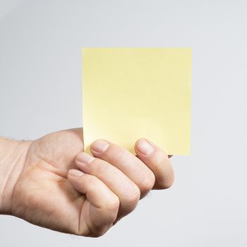 a colorful note sheet in your hand