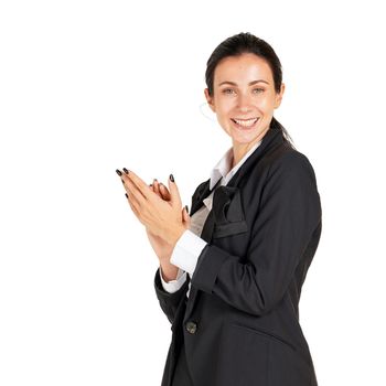 A business woman in a black suit with a smile is clapping hand and starts a successful business project. The concept of business relations Portrait on a white background with studio lights