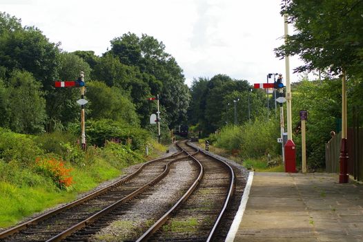 Railway tracks leading away from the station on a vintage historic railway