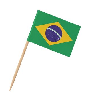 Small paper Brazilian flag on wooden stick, isolated on white