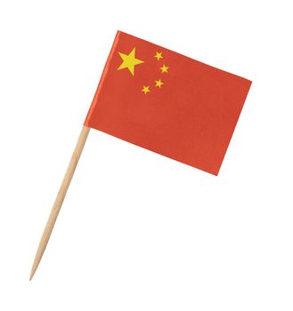Small paper Chinese flag on wooden stick, isolated on white