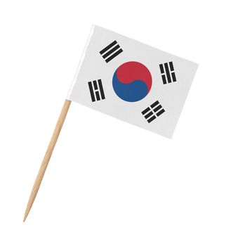 Small paper South Korean flag on wooden stick, isolated on white