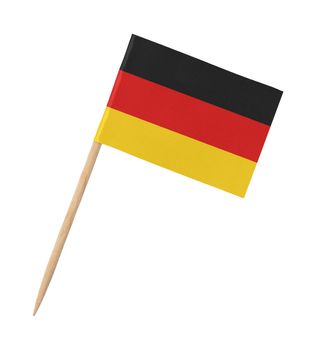 Small paper German flag on wooden stick, isolated on white