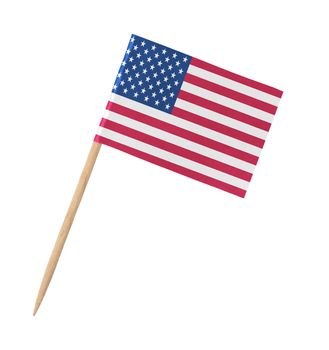 Small paper American flag on wooden stick, isolated on white