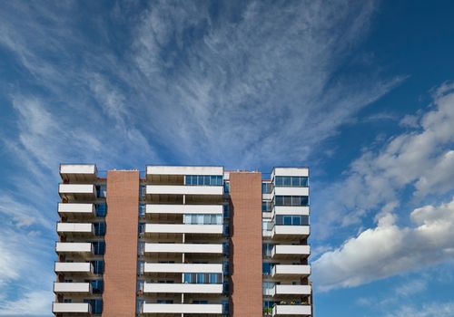 High Rise Condo Building with White Balconies