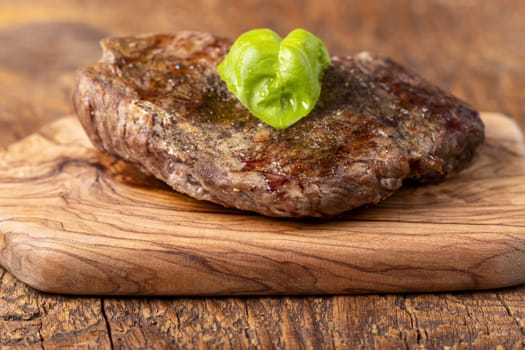 overview of a grilled steak on wood