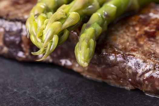 green asparagus on a steak