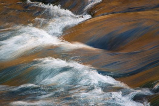 nature seaonal background rapid flow of the autumn river