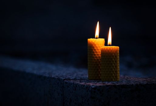 background Two candles with beeswax on the monument