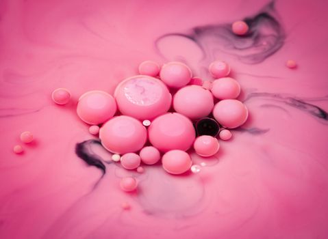 abstract background oil balls in pink water