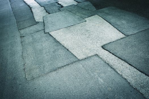 abstract background or texture asphalt road with patches