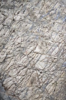 abstract background or texture grooved surface of gray limestone