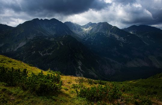 nature landscape background Dark clouds on a mountain ridge