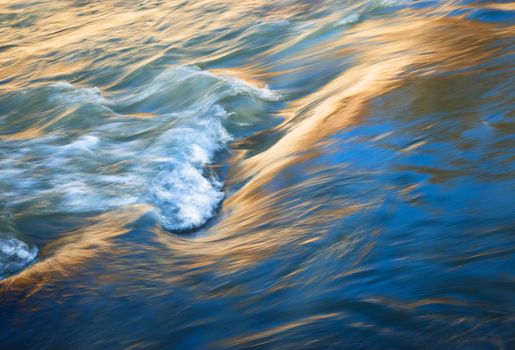 nature seasonal background reflection of the sun on the waves of the river