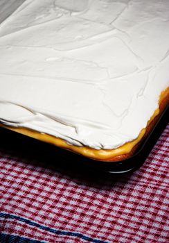 food background cream cake on baking pan