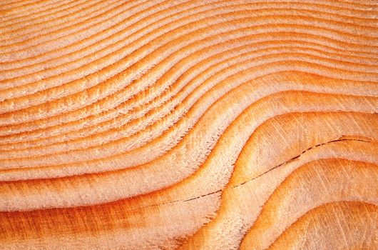 abstract background lines and waves on a wooden faceted board