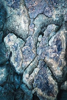 abstract background or texture dark blue rock with cracks