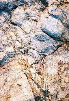 abstract background or texture detail of an old crack of limestone browning