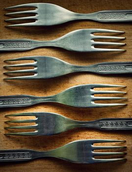 retro background or texture fork on a wooden kitchen board