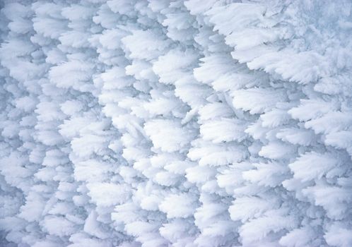 abstract seasonal background ice wings on frozen snow