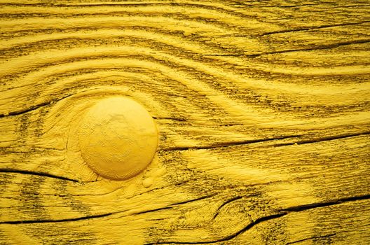 background yellow painted wooden board with metal rivet