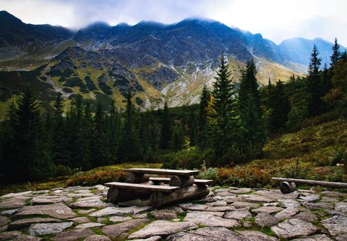 landscape background abandoned bench high in the mountains